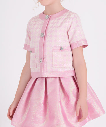 pink houndstooth jacket with sparkling buttons and pink jacquard skirt