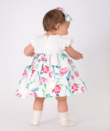 ecru baby dress with pink floral prints