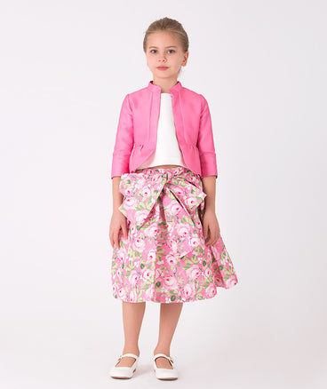 pink jacket, ecru blouse and pink floral skirt