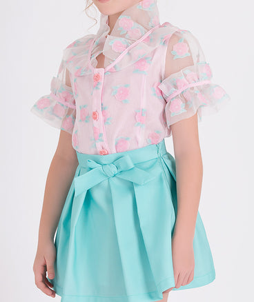 pink peony blouse with a blue skirt
