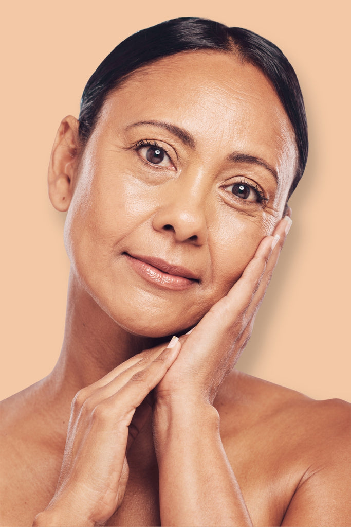 photo of a mature brunette woman model showing her beautiful skin - pureyava skincare