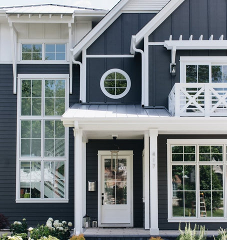 Board and batten is the style used on many modern farmhouse style exteriors. Image via Jameshardie.com