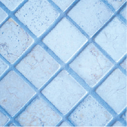 A close up of blue bathroom floor tile