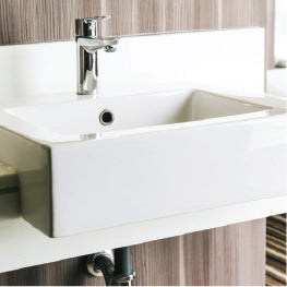 A wall mounted sink with knee clearance