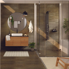 A bathroom with a round mirror and stepless shower