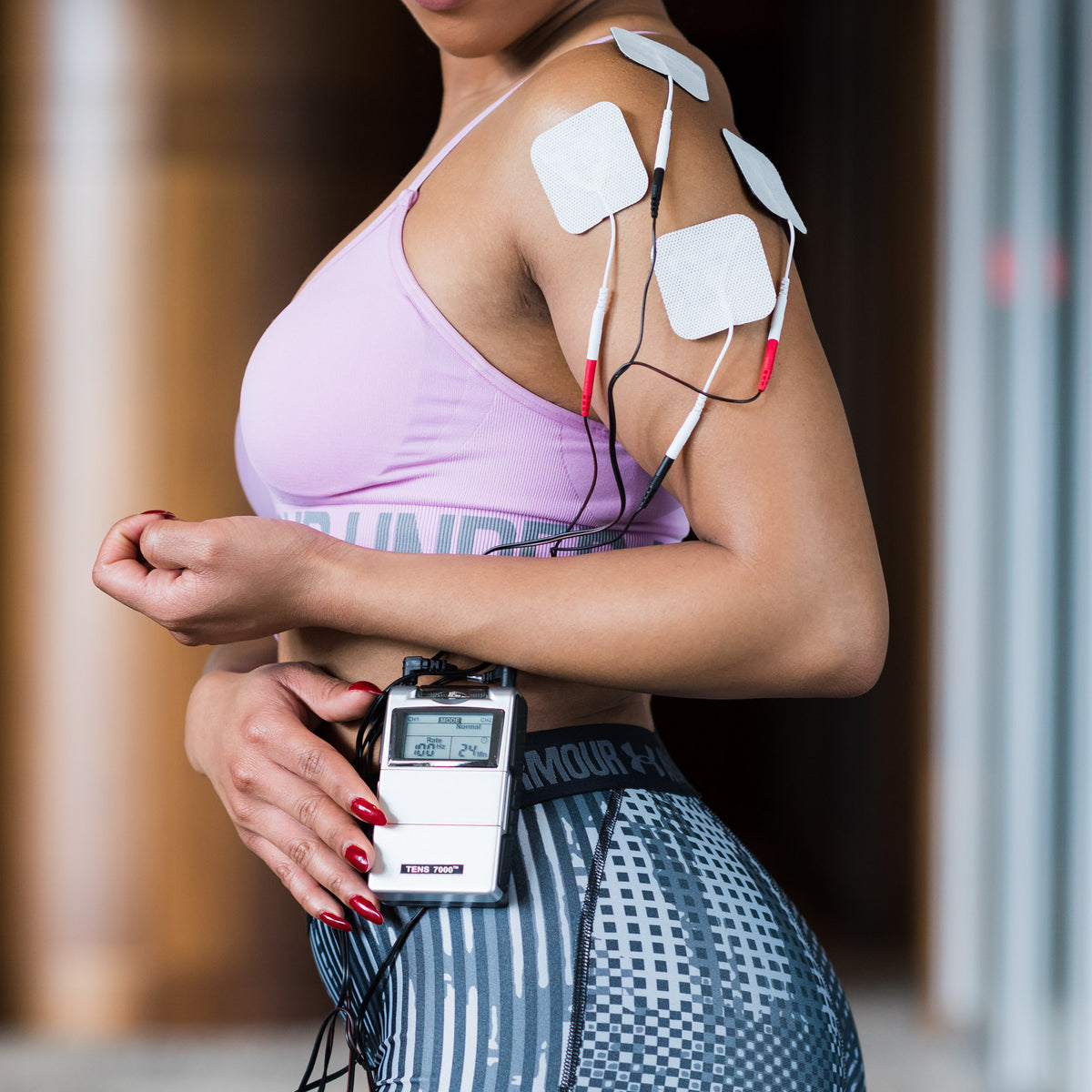 A Women using Electrodes placements on his body.