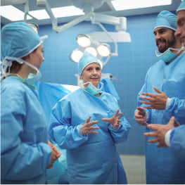 A group of doctors in a huddle