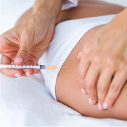 A needle being injected into hip bursitis