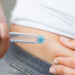 A needle being injected into a hip