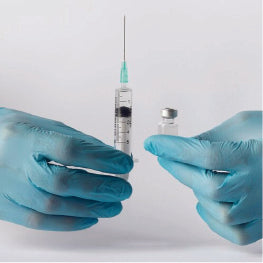 A doctor's hands holding a needle