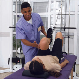 Physical therapist working with a patient