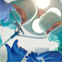 Doctors performing surgery on a person’s hip