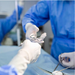 Surgeons doing surgery on a hip flexor strain