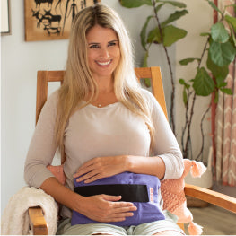 A woman using a hot/cold wrap over her hip flexor