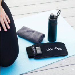 A red light therapy device on a yoga mat