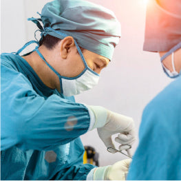 Surgeons performing surgery on a hip flexor strain