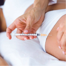 A needle being injected into a persons hip