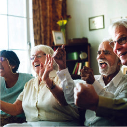 A group of elderly people cheering