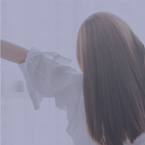 A woman waking up stretching