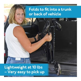 Woman places Carex Trio Rolling Walker in trunk. Text: Folds to fit trunk. Lightweight at 10 lbs.