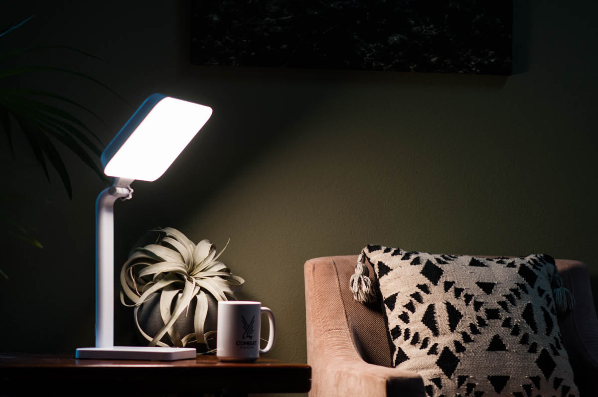 A light therapy lamp turned towards a chair