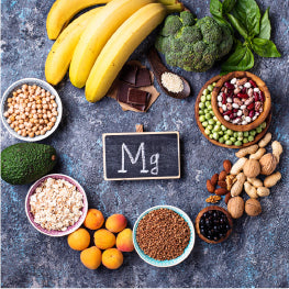 A group of Magnesium rich foods with “Mg” written in chalk