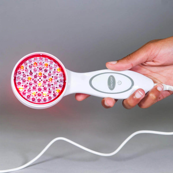 A close up of the DPL Clinical Handheld Light Therapy being held