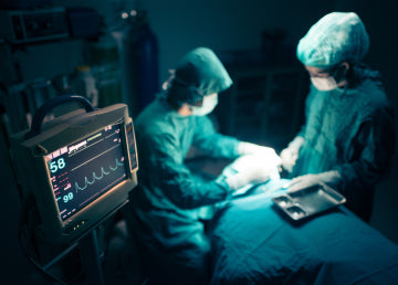 Two doctors performing surgery