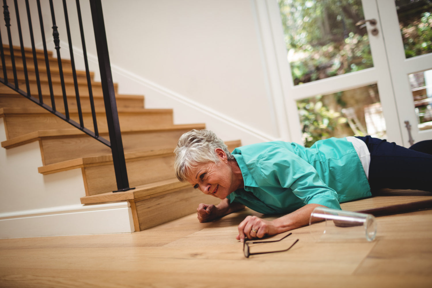 An elderly woman who has fallen downstairs