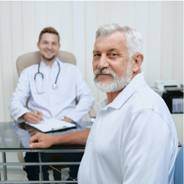 An elderly man in front of a doctor