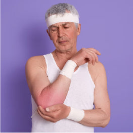 An elderly man holding his elbow in pain