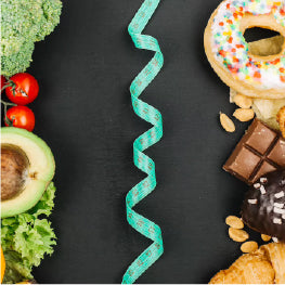 Healthy foods and unhealthy foods divided by measuring tape