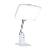 A white therapy lamp with a large head