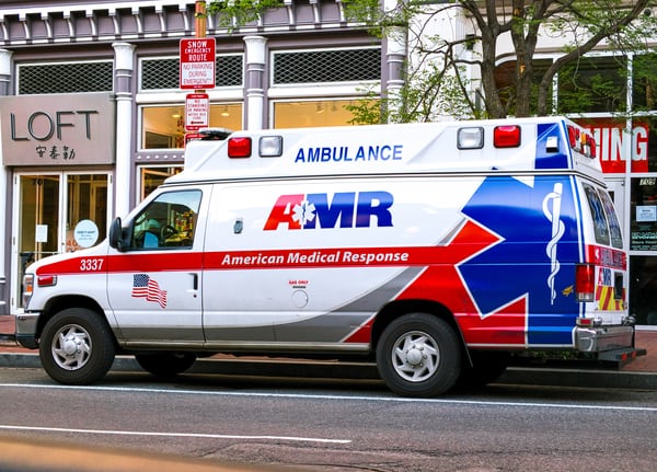 An ambulance parked on the side of a street