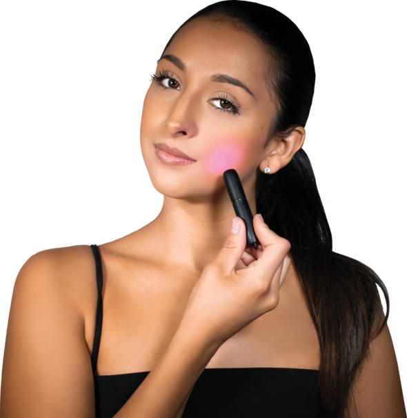 A woman placing the  reVive Light Therapy® Poof over her face on a white background