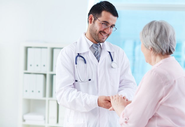 A medical doctor talking to a senior patient