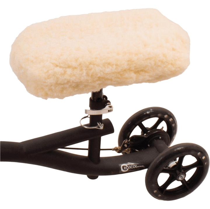 Knee scooter cover on a knee scooter over a white background