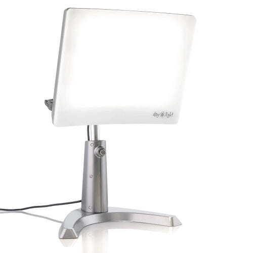 A gray therapy lamp with a large head