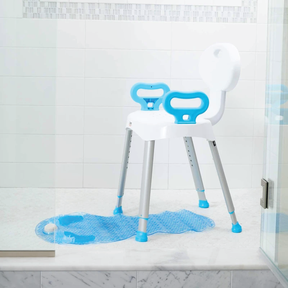 The Carex E-Z Bath & Shower Seat in a shower over a blue bath mat