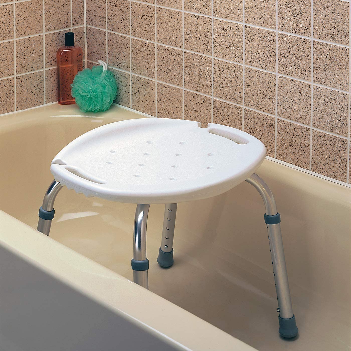 The Carex Adjustable Bath & Shower Seat in a bathtub