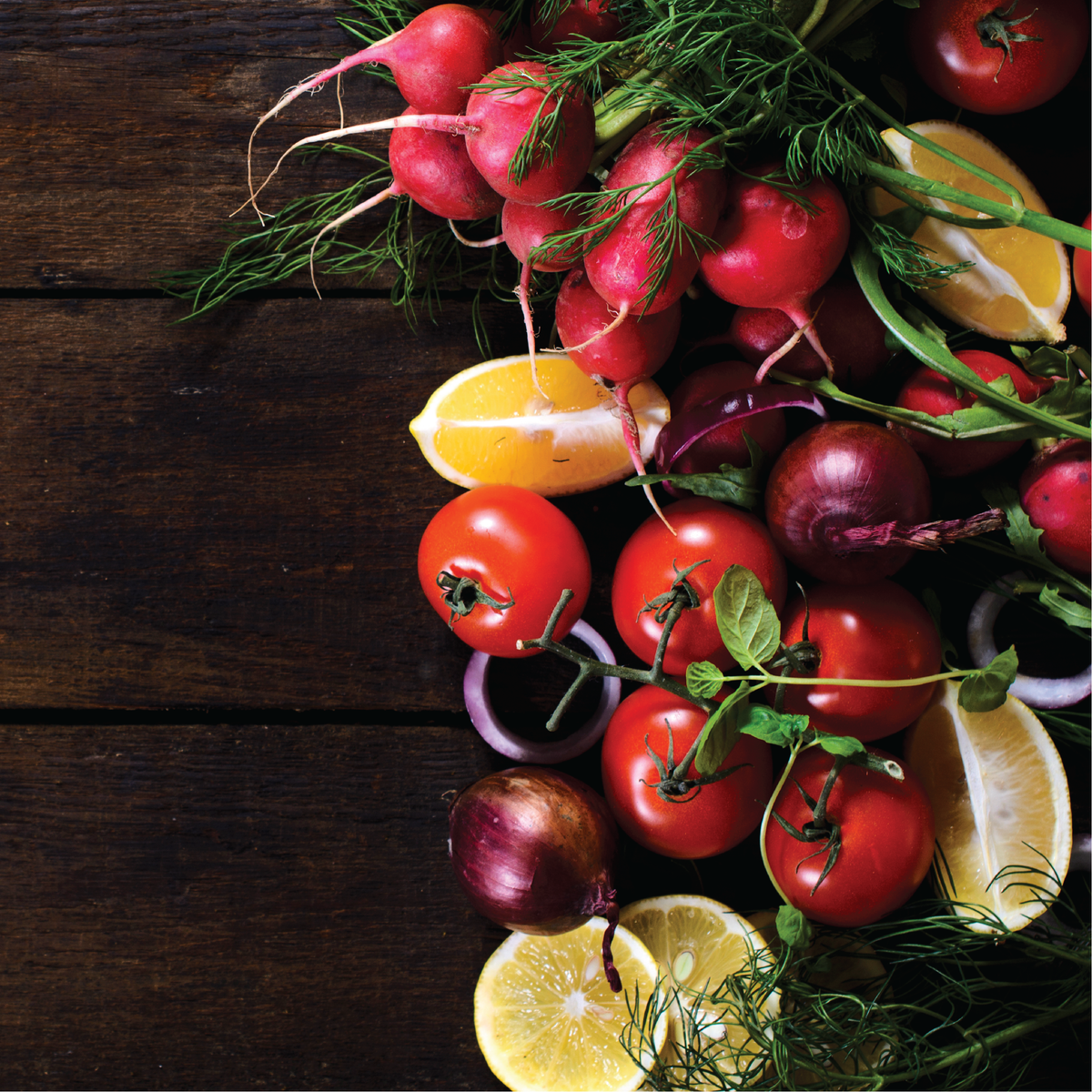 Various vegetables on a wood surface