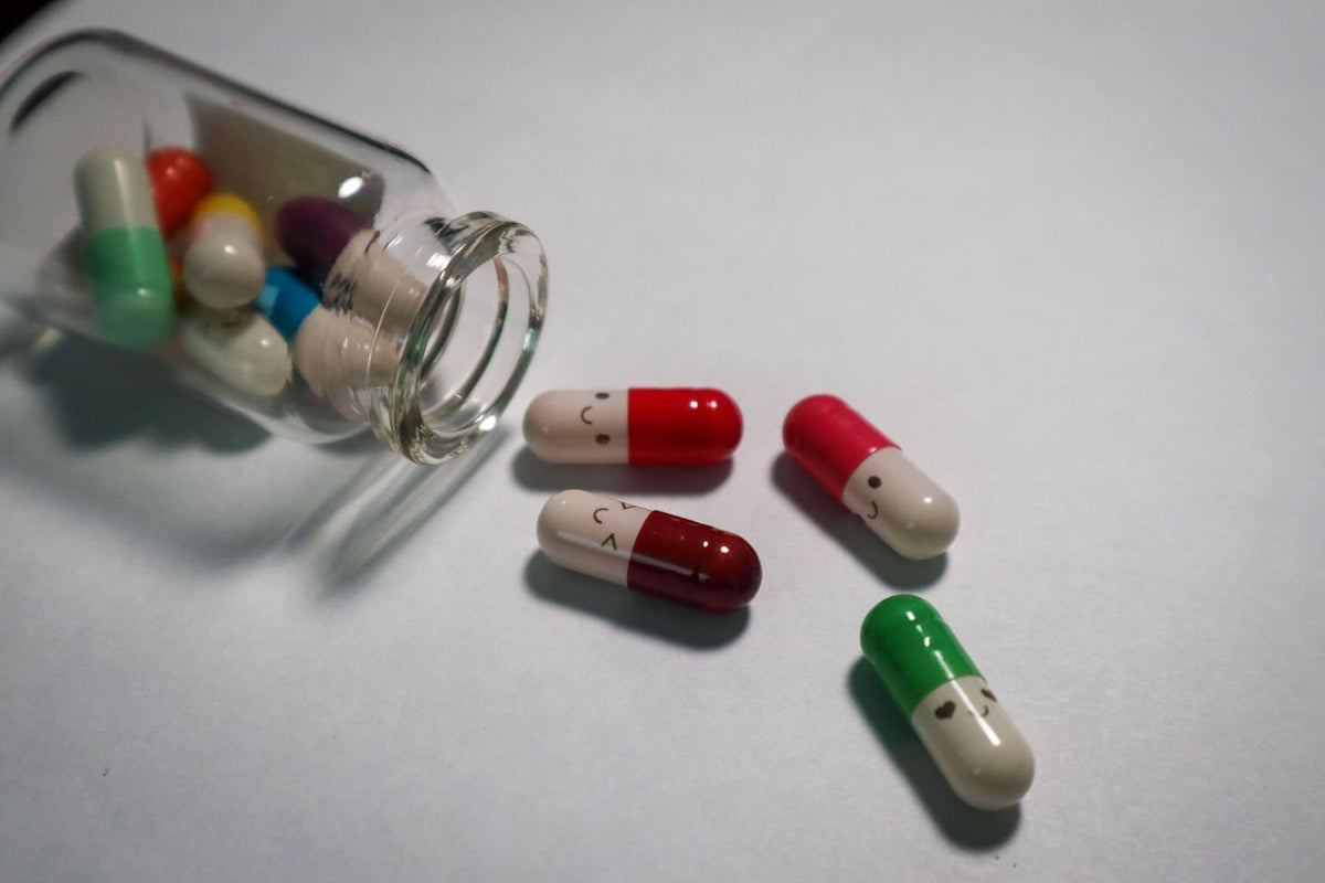 Various pills with faces drawn on them