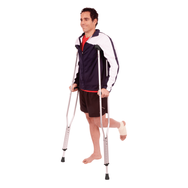 A man with an injured foot using the Carex Forearm Crutches on a white background 
