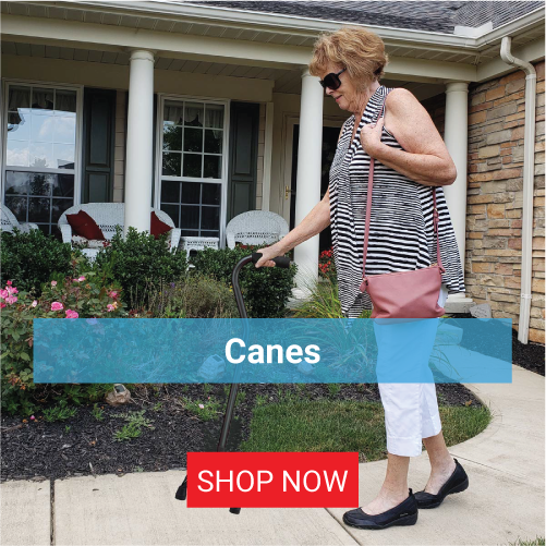 A woman using a walking cane outside