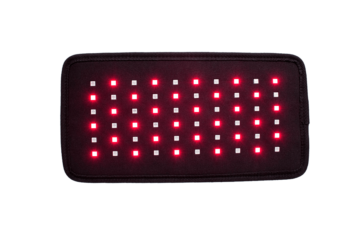 A red light therapy device with its lights on