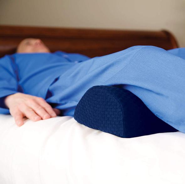 Sleeping positions for back pain relief: On your back with a pillow under your knees