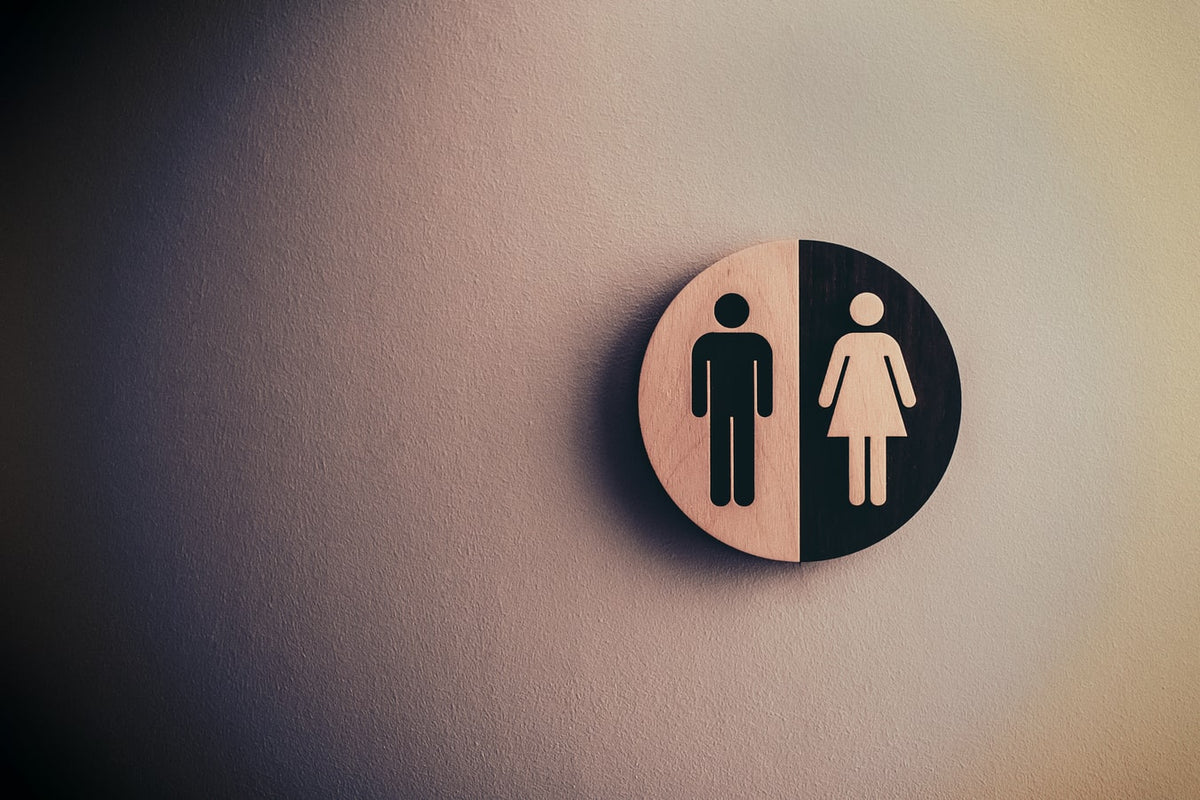 A man and woman gender sign on a wall