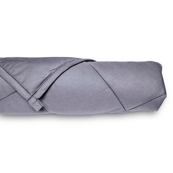 The Bed Buddy Weighted Blanket rolled up on a white background