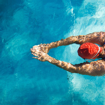 A person swimming in a pool