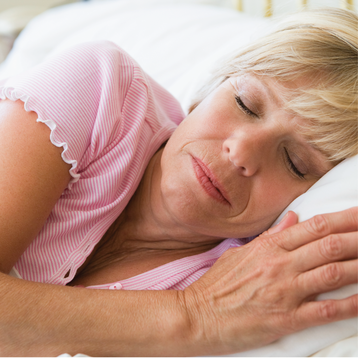 A woman sleeping on her side